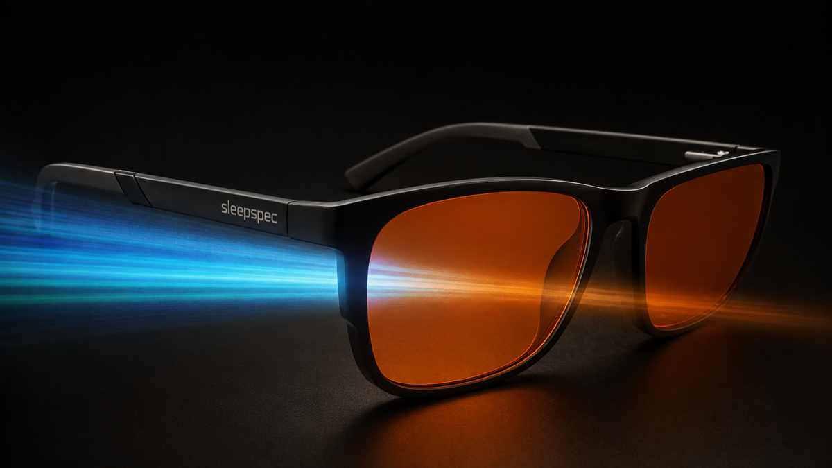 SleepSpec amber lenses shown filtering blue-green light in a technical product visual.