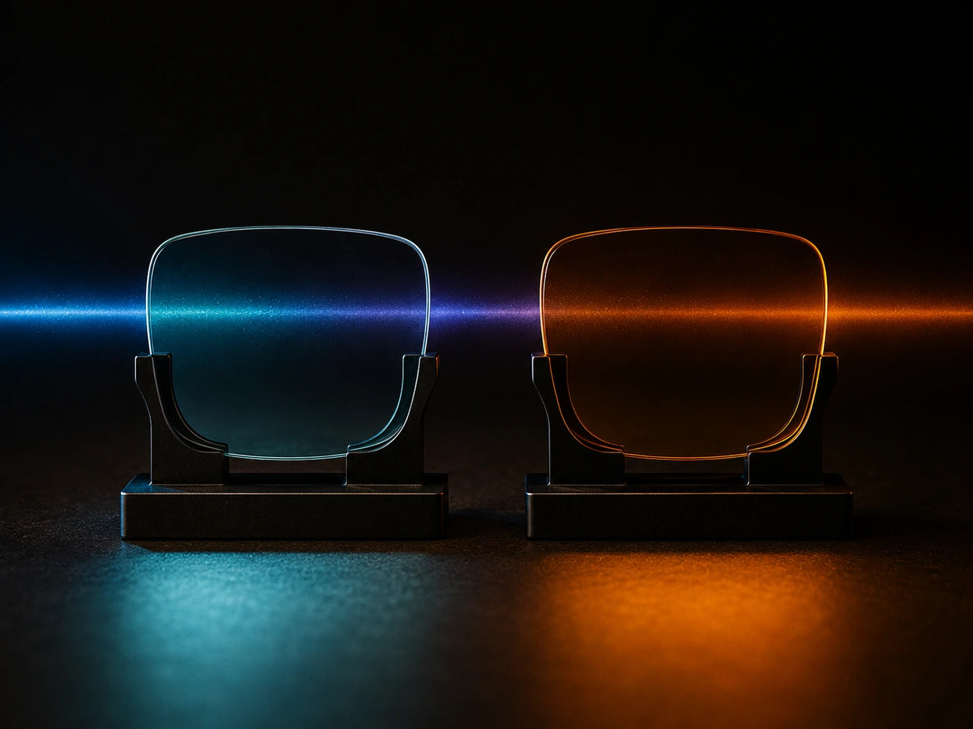 A clear lens and an amber lens standing side by side in the same blue-green beam; the cool light passes through the clear lens and is stopped by the amber one