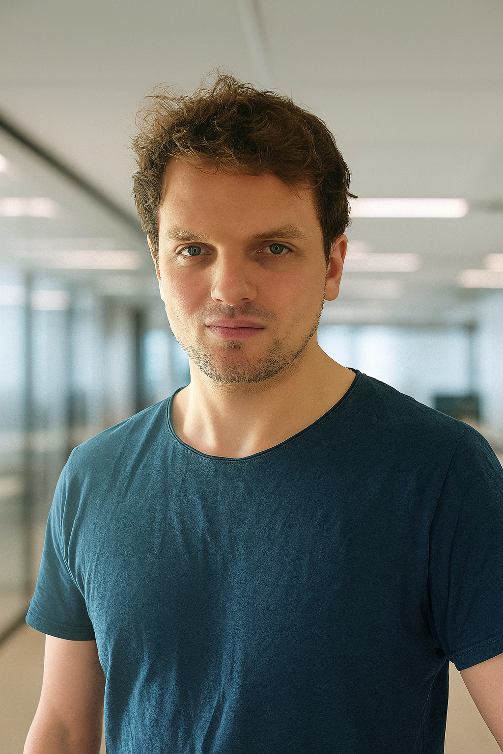 Founder Angus Kekwick wearing SleepSpecs in a warm, lamplit office